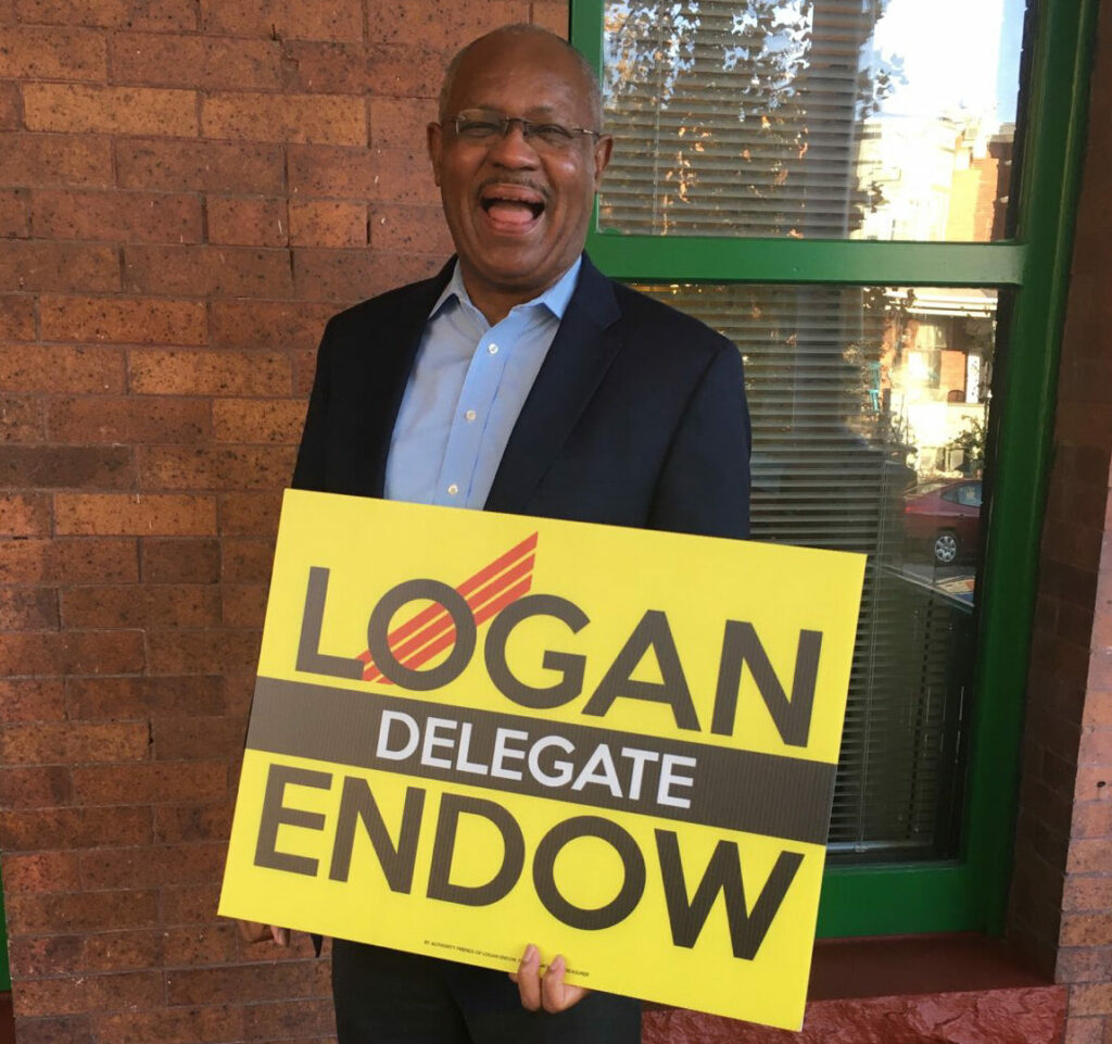 Councilmember Carl Stokes with Logan Endow Sign